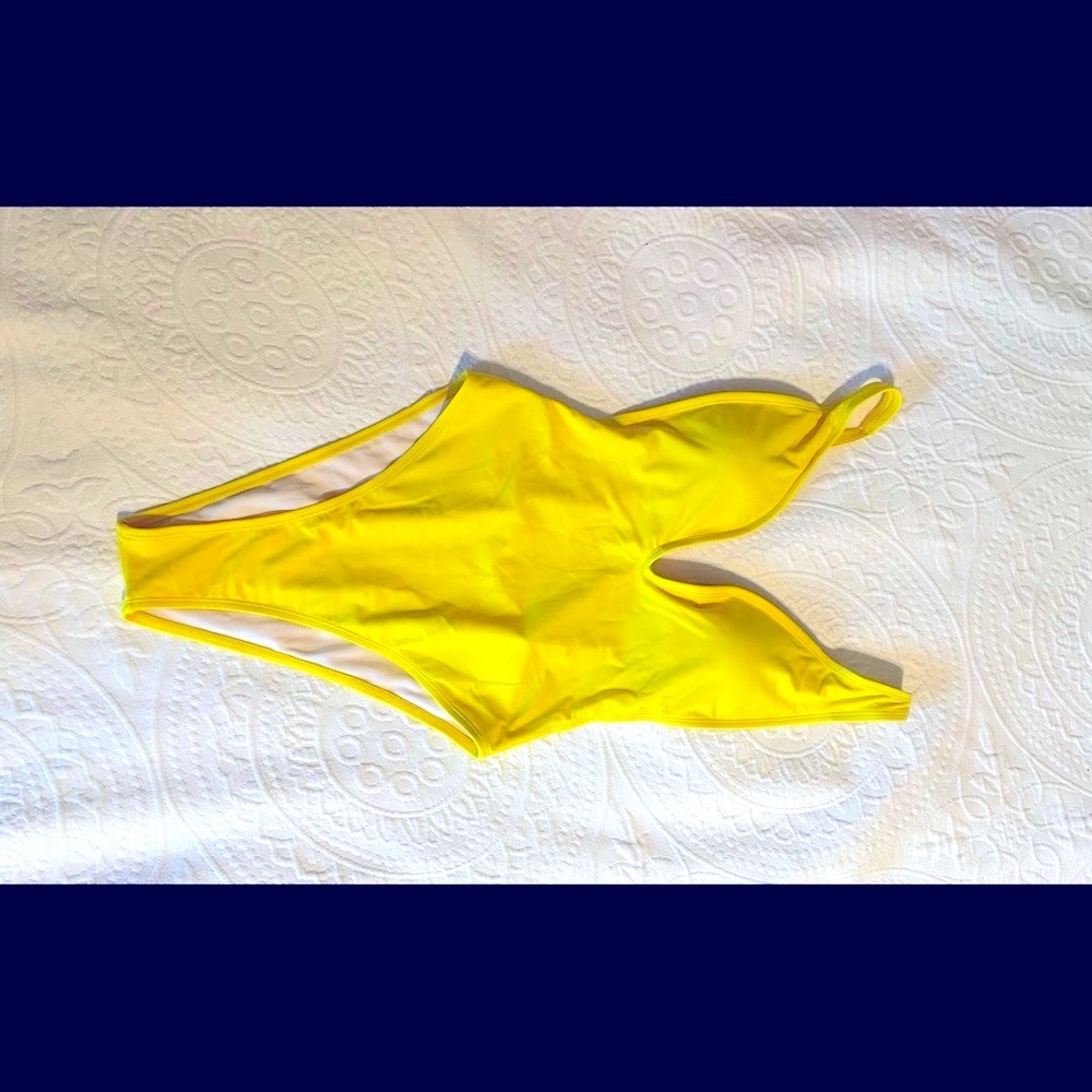Yellow Size Small  New without tags. Looks like Bikini in back.